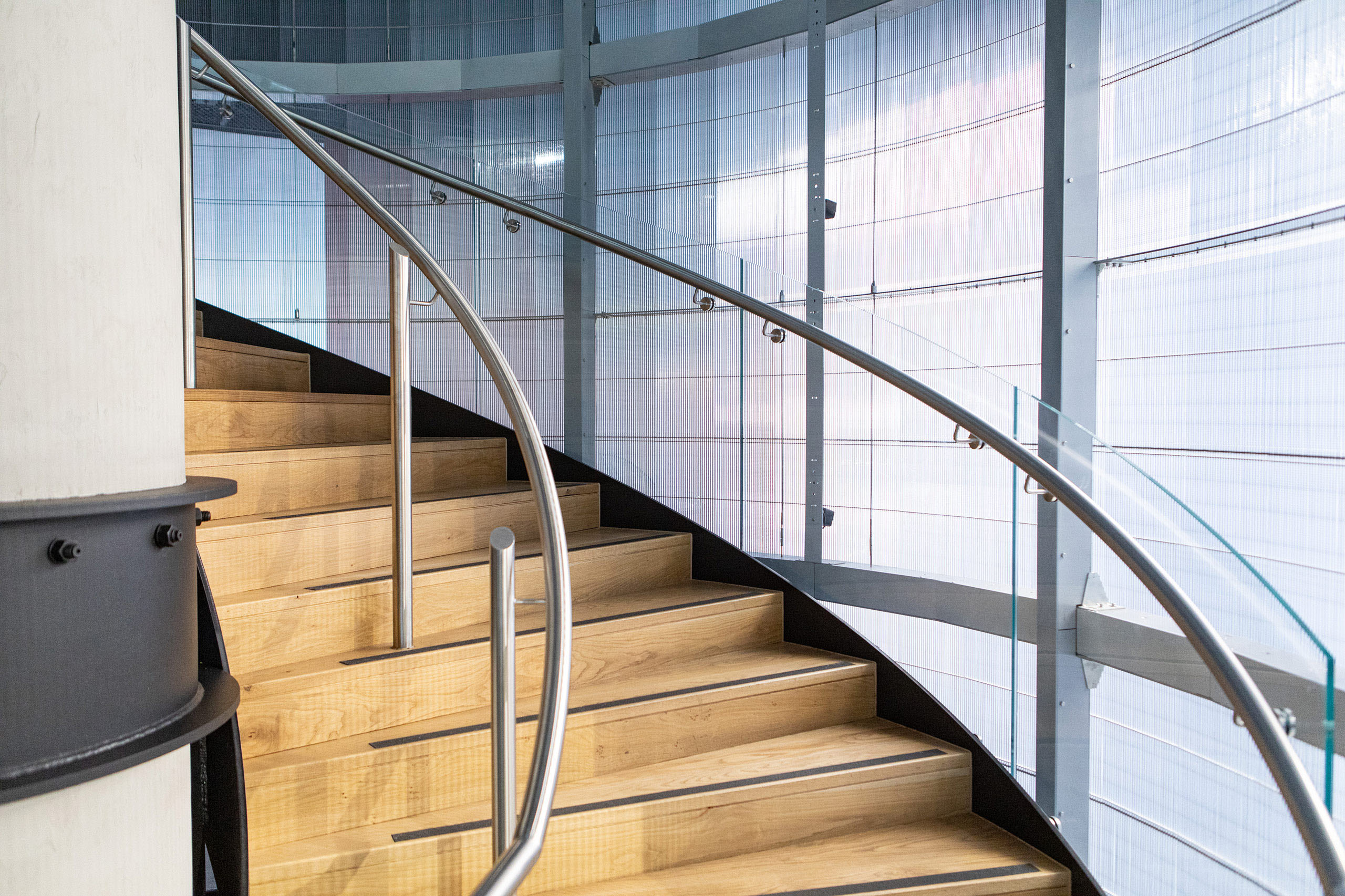 Impressive circular staircase at Sydney luxury automotive studio ...