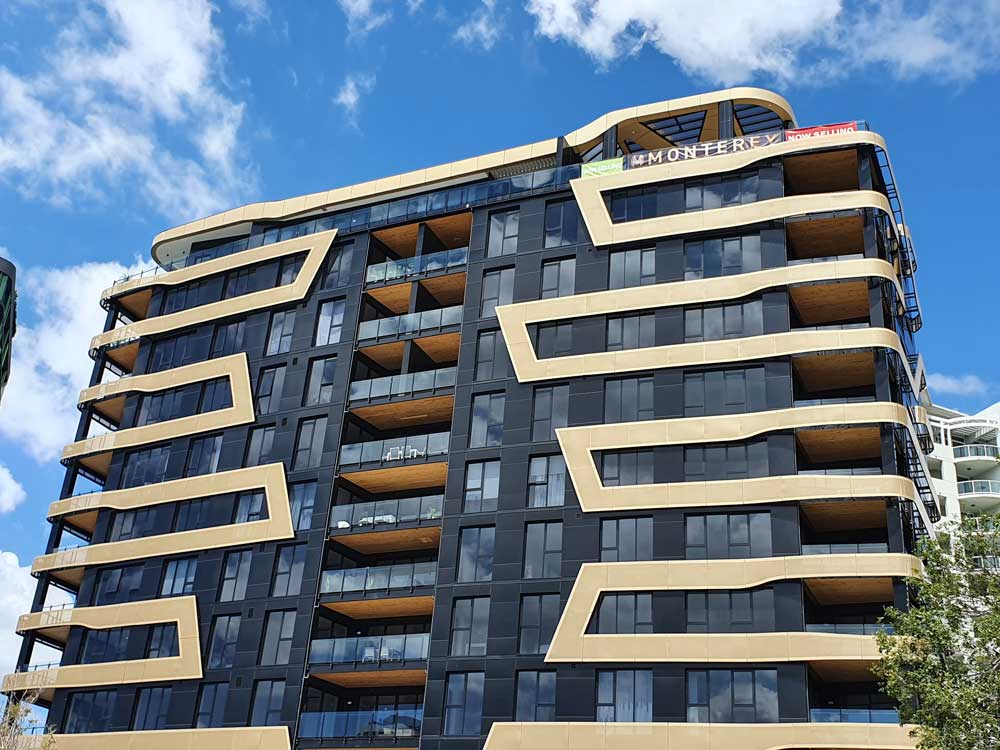 Black and gold Aodeli SAP cladding stuns on iconic Monterey Apartments ...